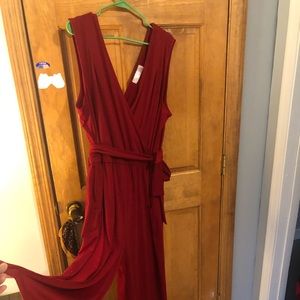 Sleeveless red jumpsuit with belt